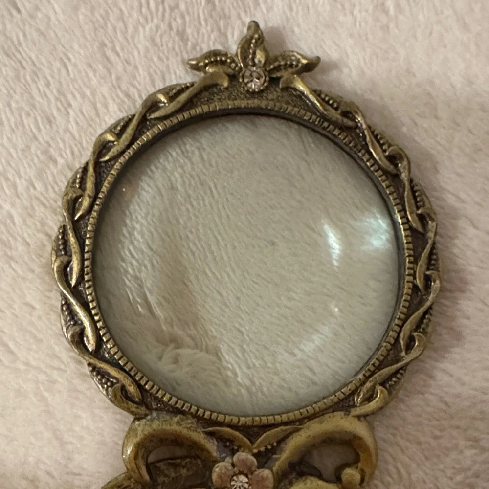 Vintage Handheld Magnifier glass with two intricate Floral Designs